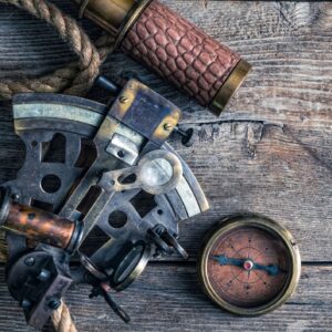 Nautical equipment on the wooden background